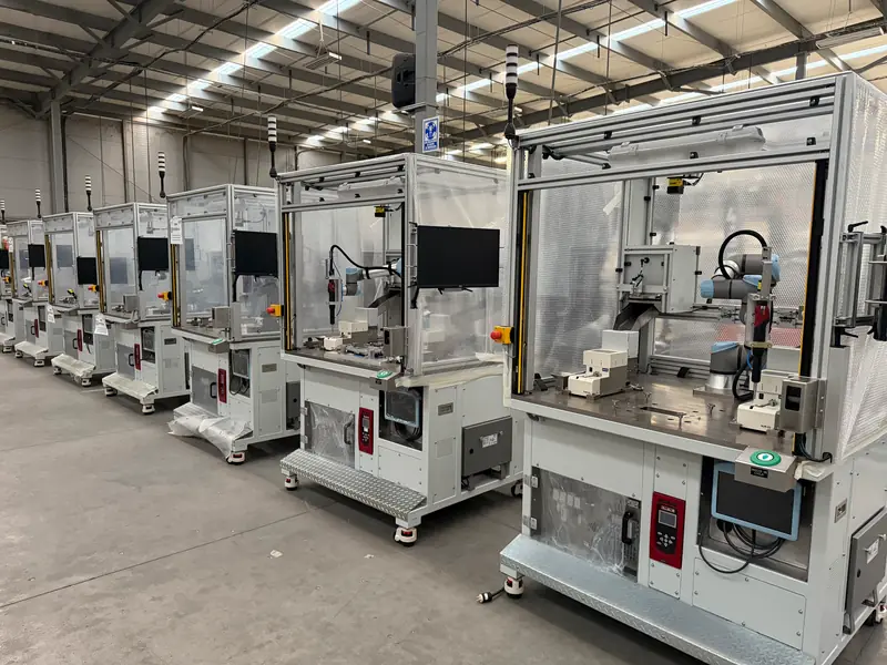 A row of AMD Machines automated stations on the shop floor before shipment