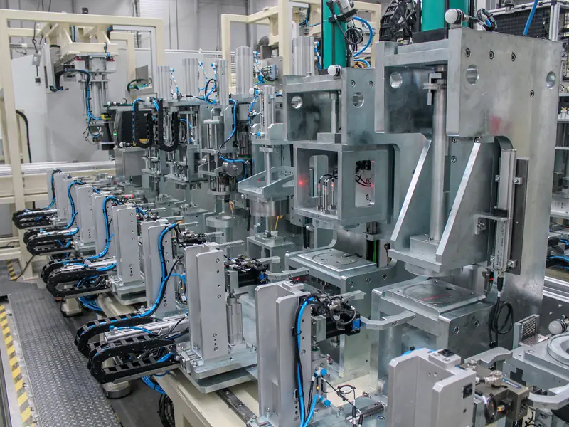 A line of automated assembly stations built by AMD Machines