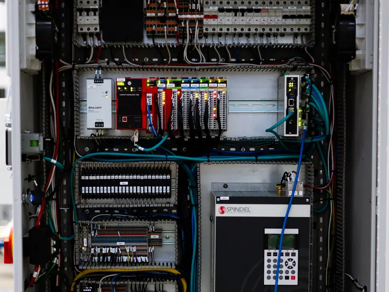 Automation control panel with PLC, I/O modules and a drive