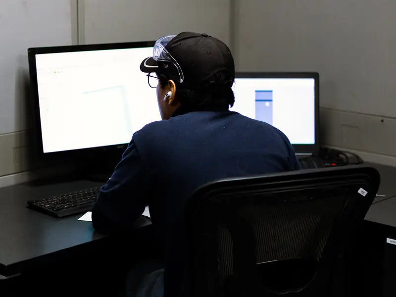 AMD Machines engineer working on a machine design at a CAD workstation