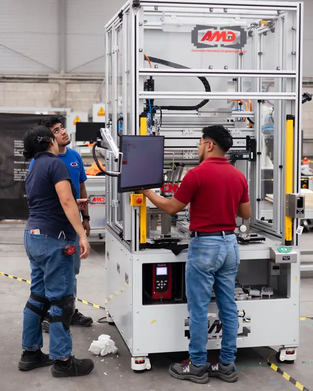 AMD Machines engineers testing a machine on the shop floor before shipment