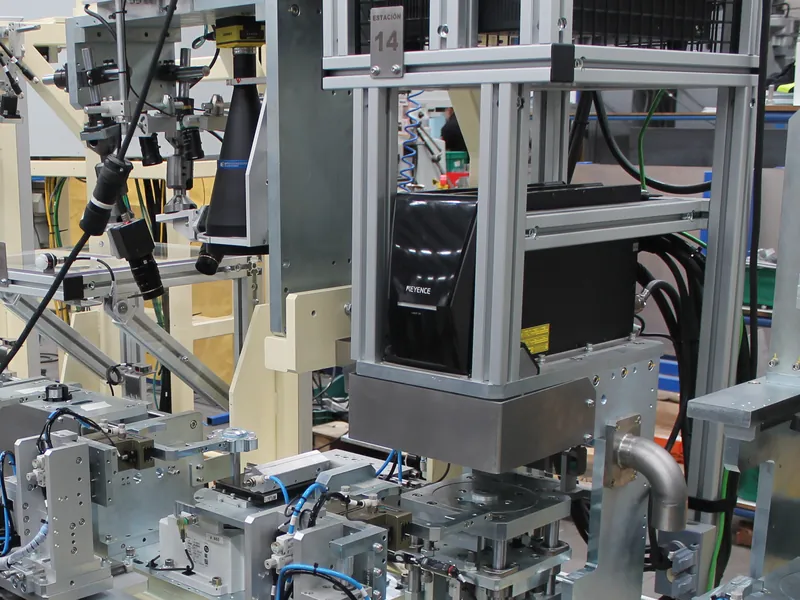 Keyence laser marker over a part fixture at station 14 of a multi-station automated machine, built by AMD Machines