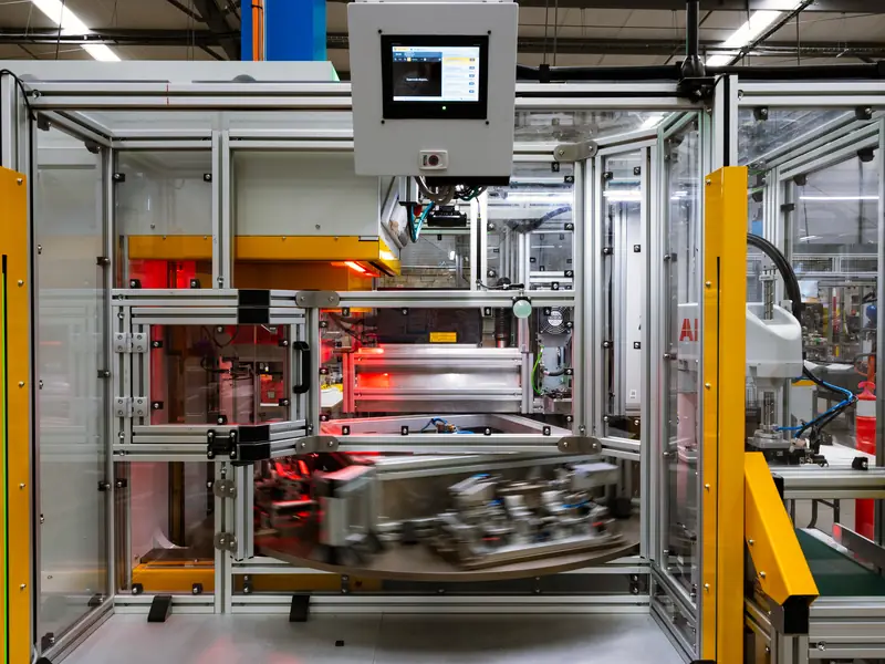 Automated assembly cell with an operator HMI and a rotary fixture, built by AMD Machines