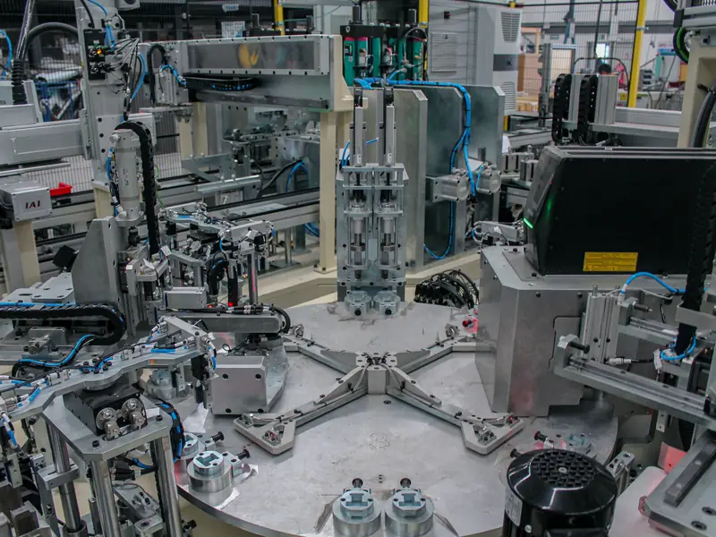 Rotary dial assembly machine with multiple stations, built by AMD Machines