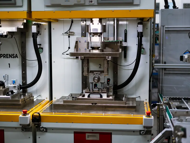 Press stations in an automated assembly line built by AMD Machines